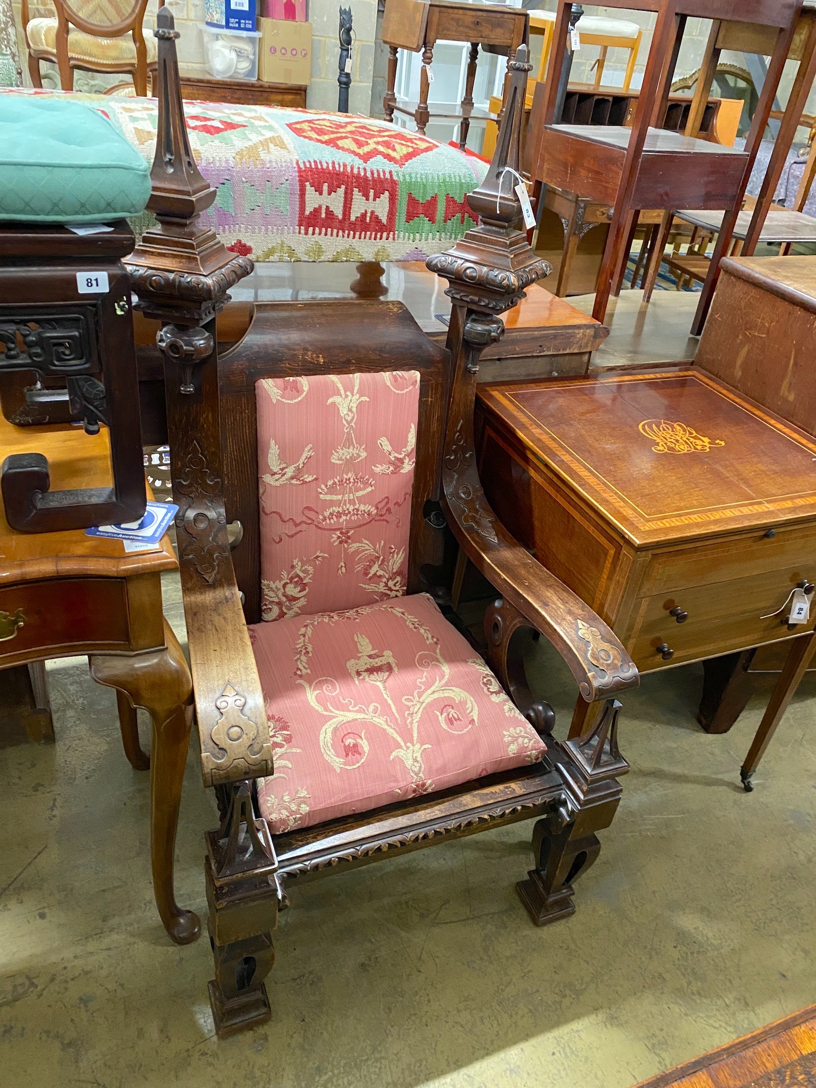 A late 19th century Gothic Revival painted simulated oak throne chair, width 76cm, depth 74cm, height 144cm